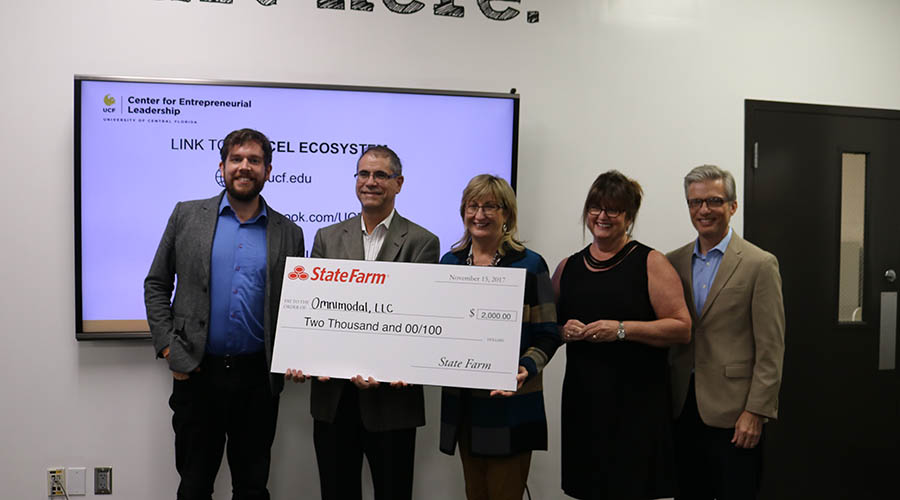 Social Venture Winner Receiving State Farm Check